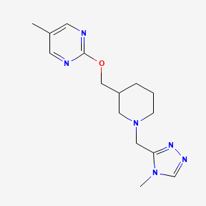 B2393155 5-methyl-2-({1-[(4-methyl-4H-1,2,4-triazol-3-yl)methyl]piperidin-3-yl}methoxy)pyrimidine CAS No. 2379975-85-4